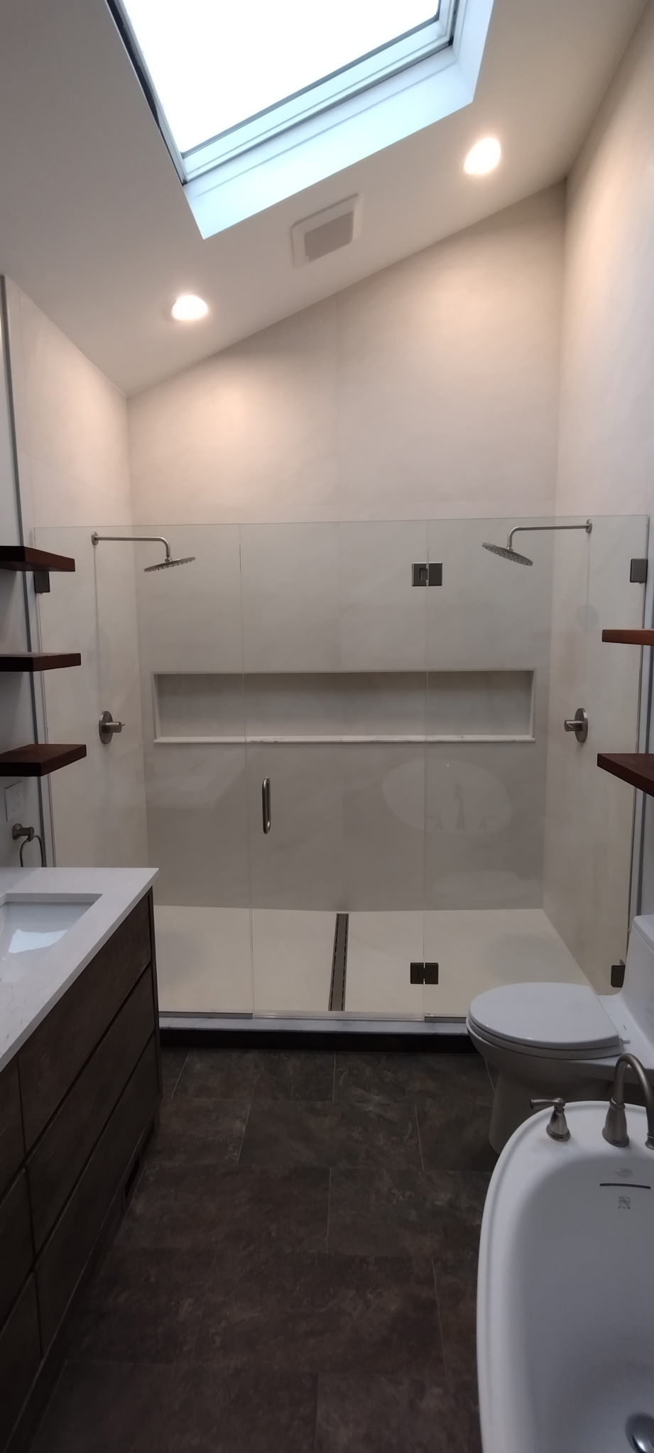 Chagrin Falls bathroom after renovation: New glass shower and skylight