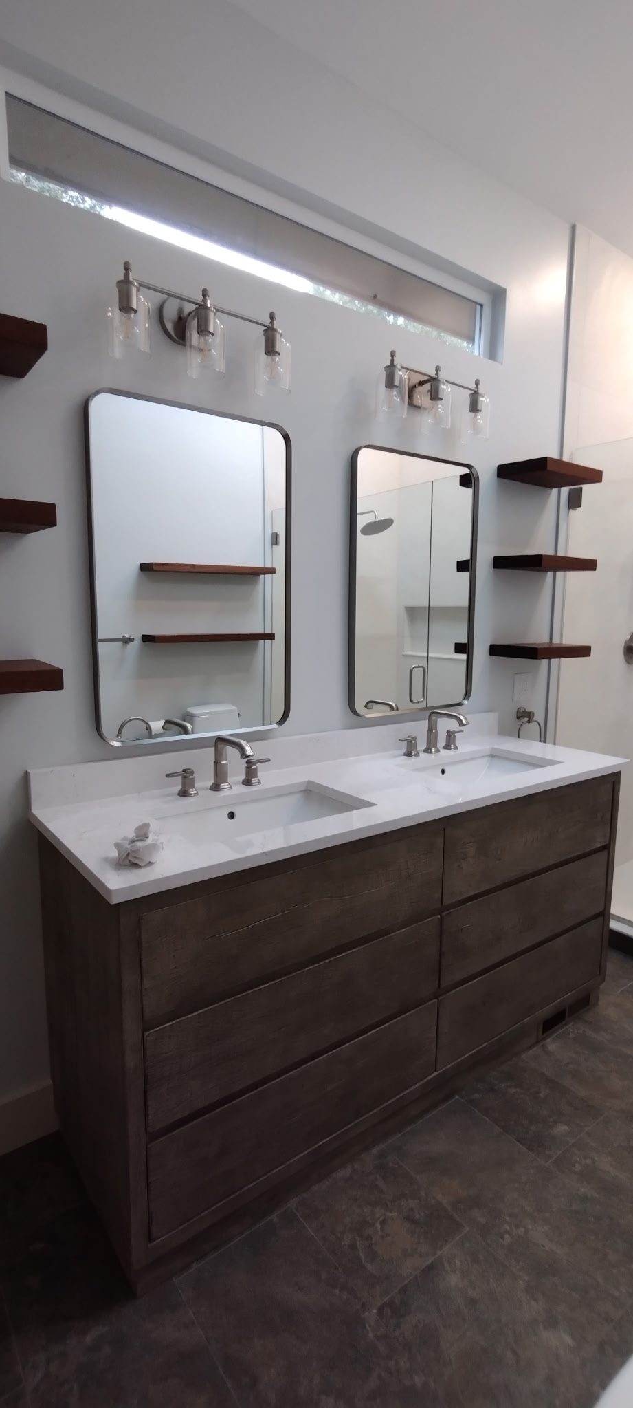 Chagrin Falls bathroom after renovation: New double vanity and floating shelves