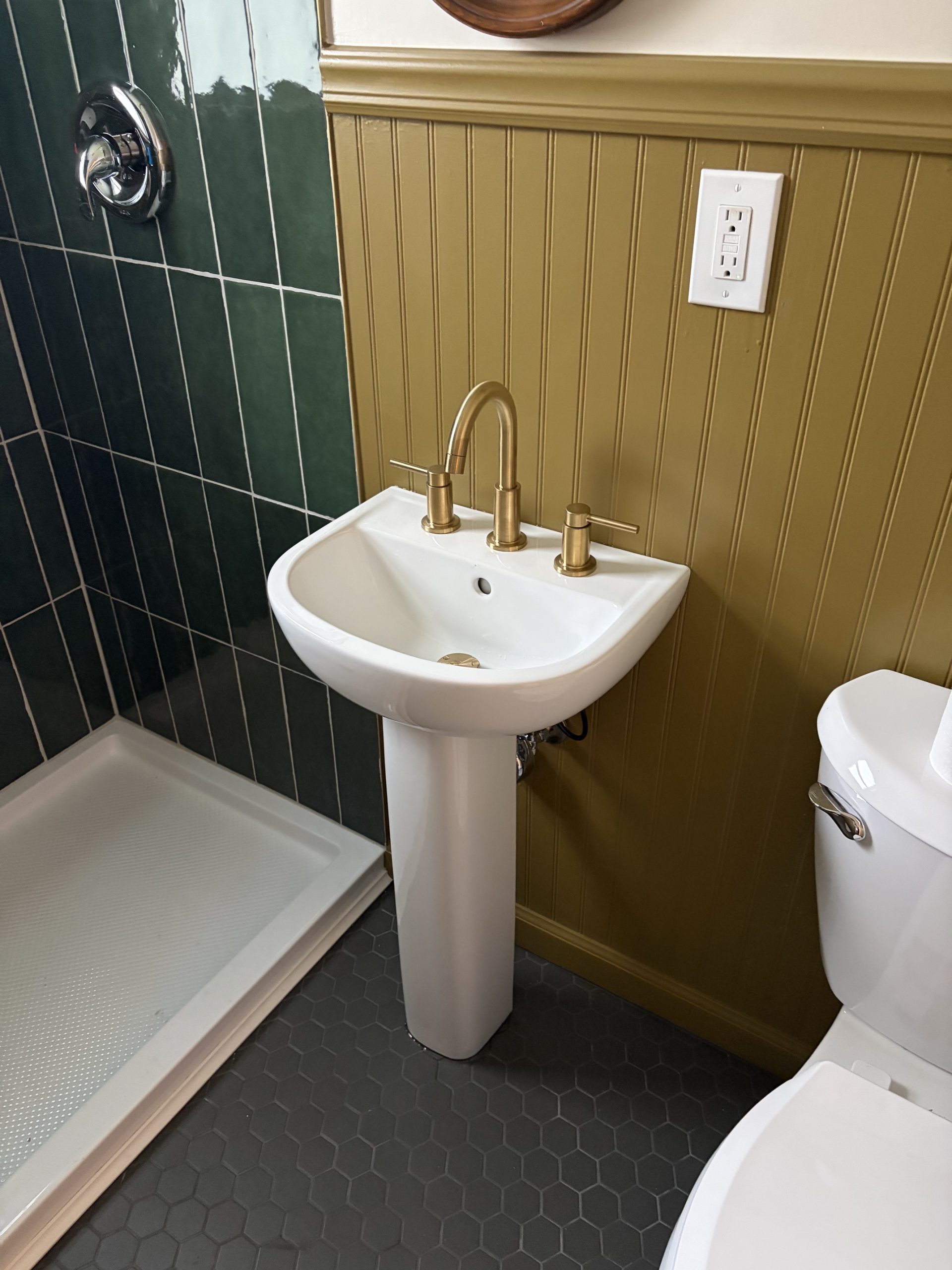 Kent bathroom remodel with pedestal sink and green tile
