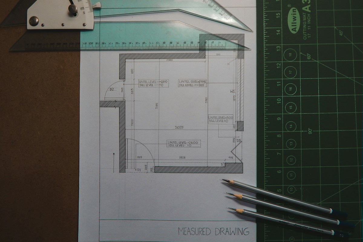Renovation planning drawing and pencil representing kitchen and bathroom layout design